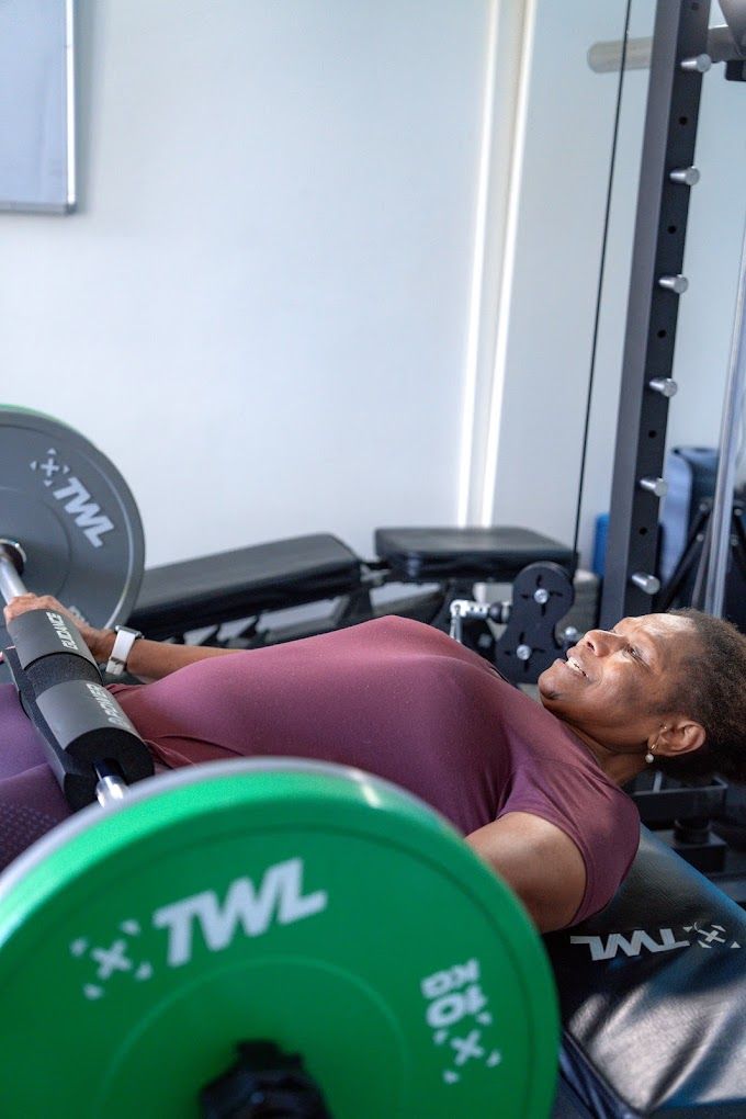 A client squatting with a barbell