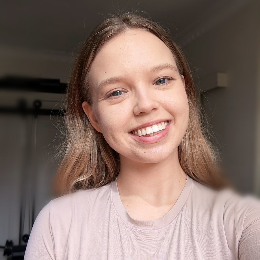 Liubov smiling in her home gym